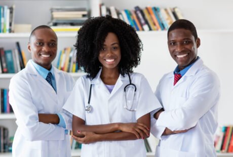 General practitioner and doctor and nurse as african american medical team